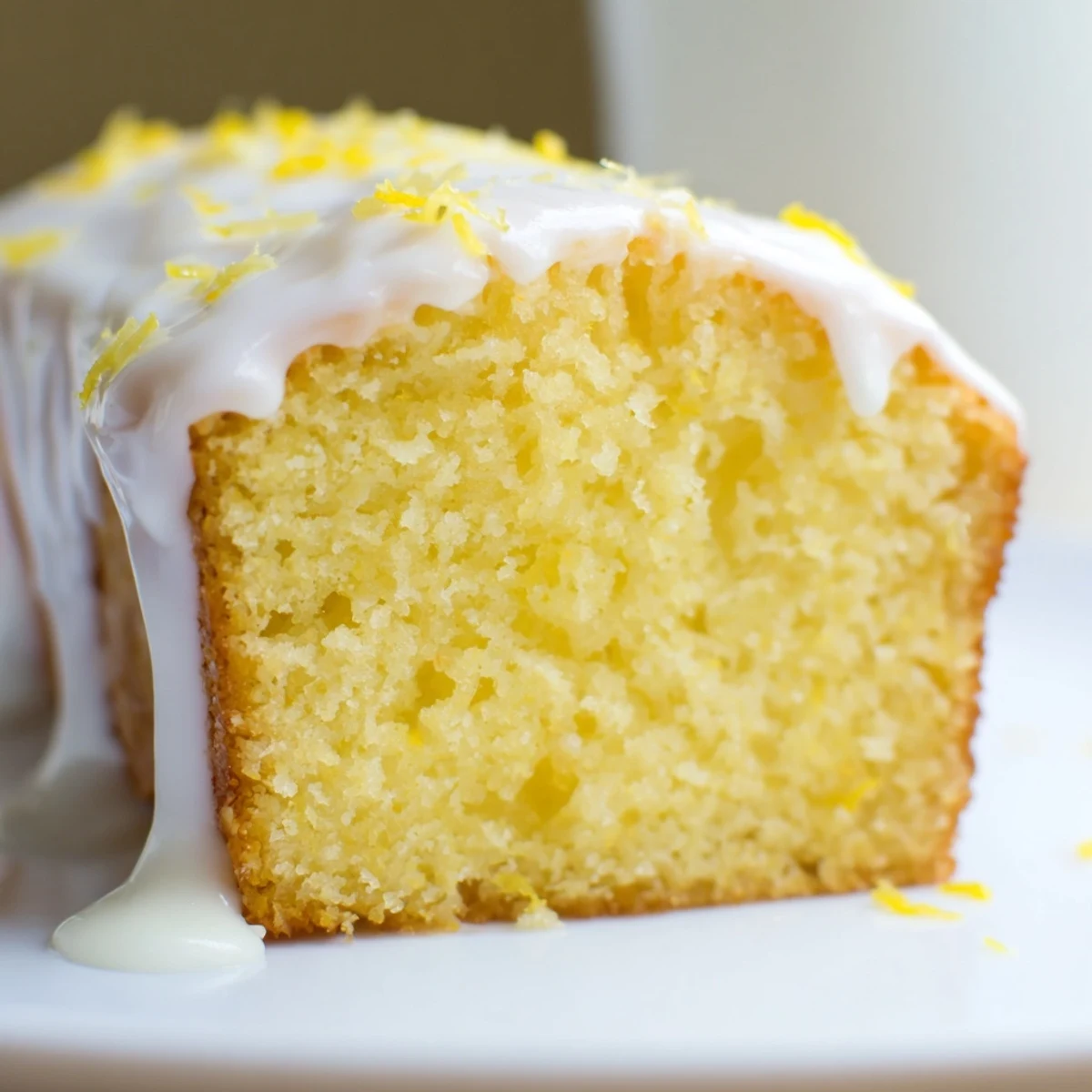 Moist Lemon Loaf Cake with Icing showing tender crumb and sweet glaze, ideal for afternoon tea or a sweet snack.