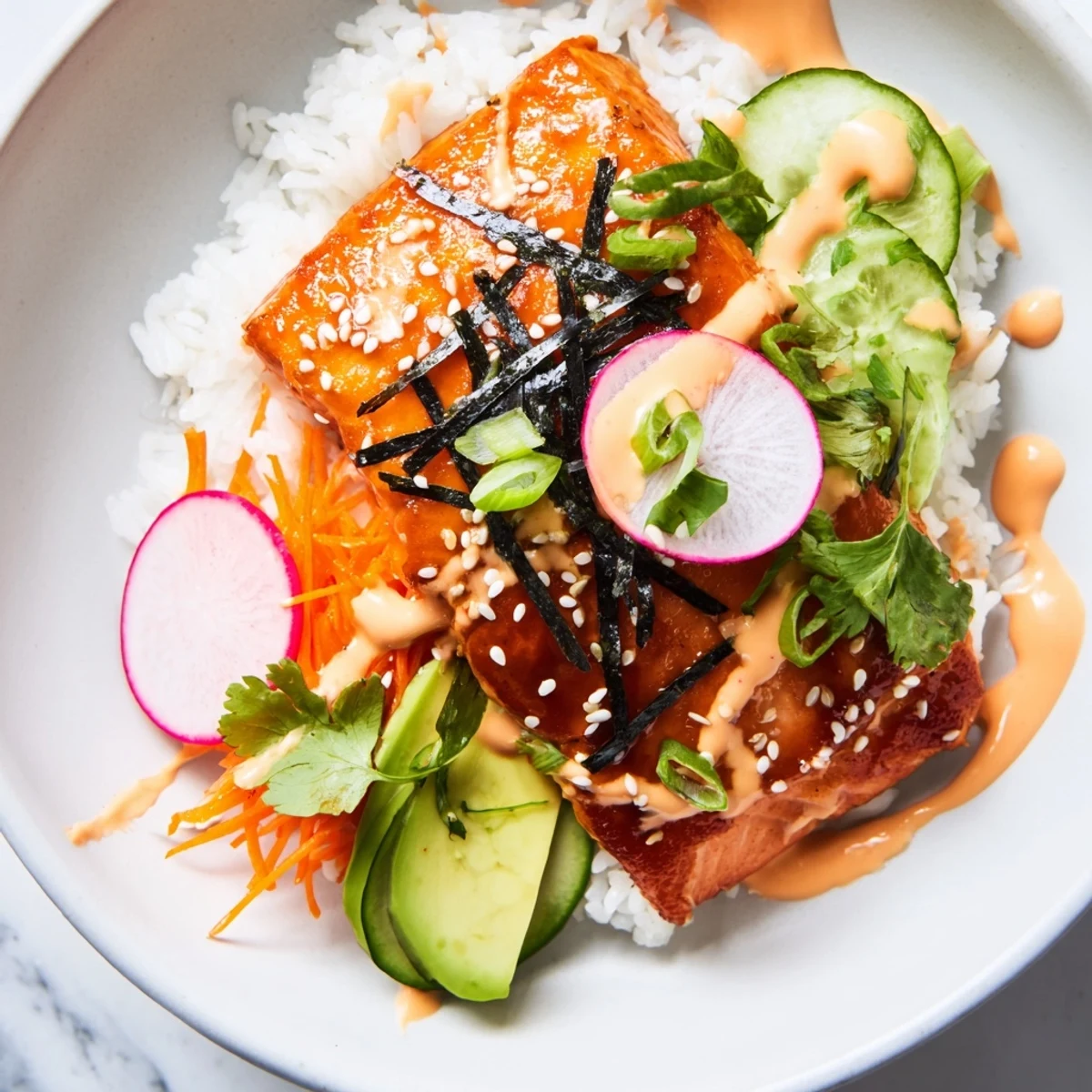 Juicy salmon glazed with sweet teriyaki sauce served over rice in these colorful taco bowl bowls.