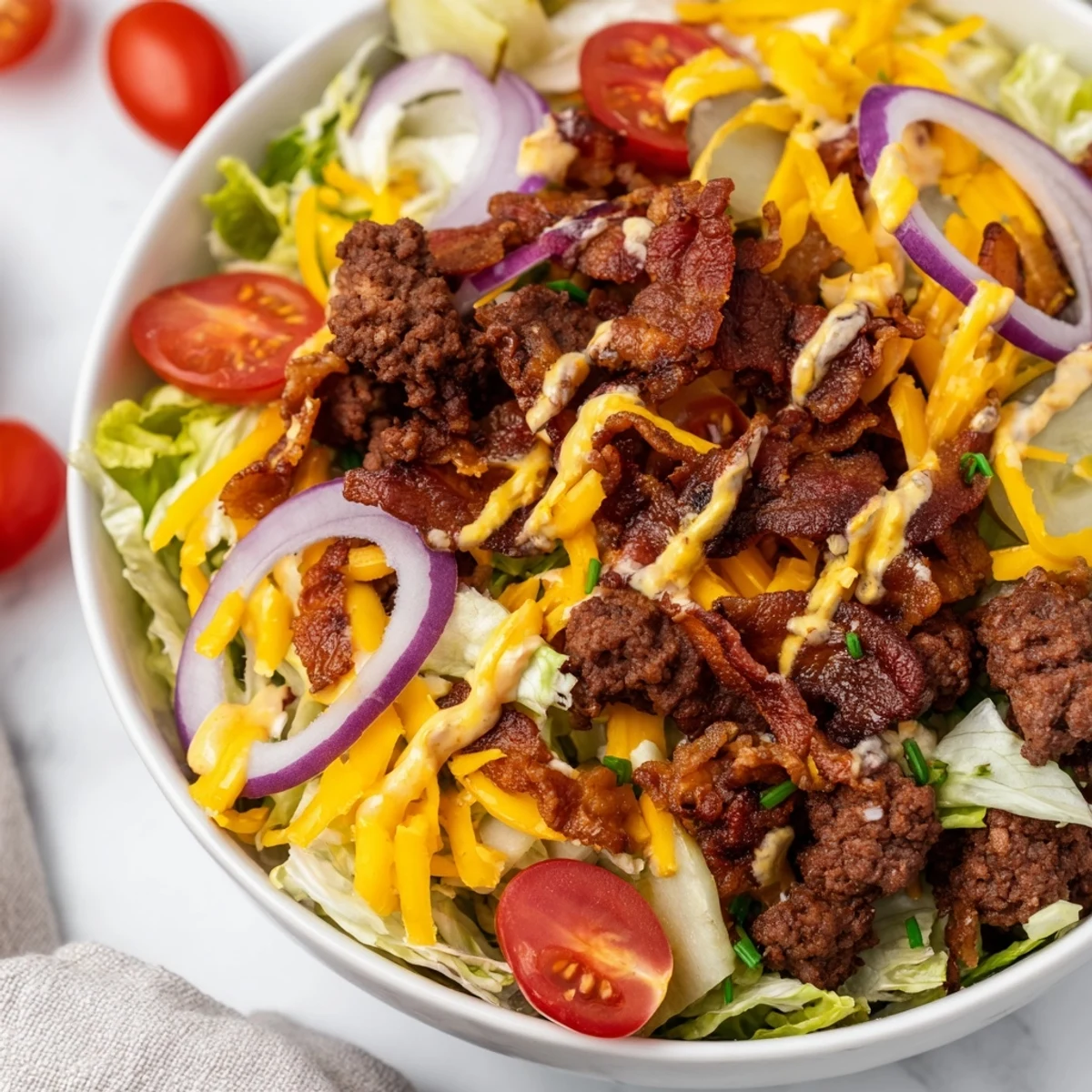 A vibrant Smash Burger Bowl featuring savory beef, crisp vegetables, and melty cheese in a convenient serving bowl.