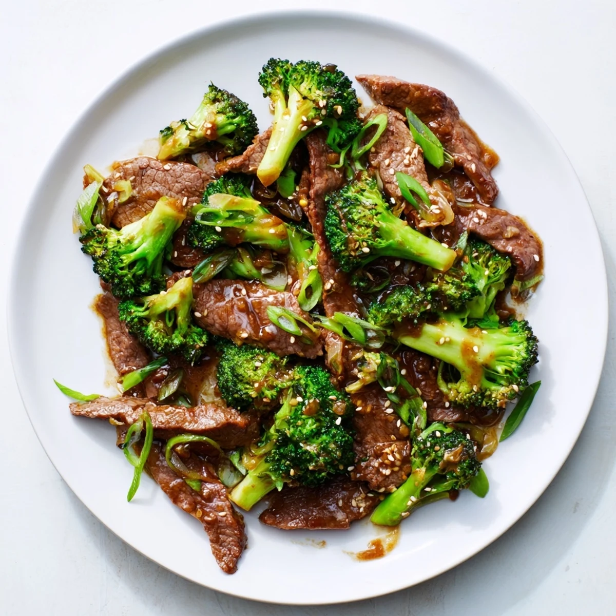 Steaming hot Better Than Takeout Beef With Broccoli in a glossy brown sauce served over fluffy white rice.