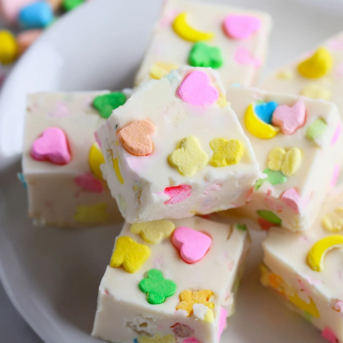 Creamy white chocolate Easy Lucky Charms Fudge topped with colorful marshmallow bits