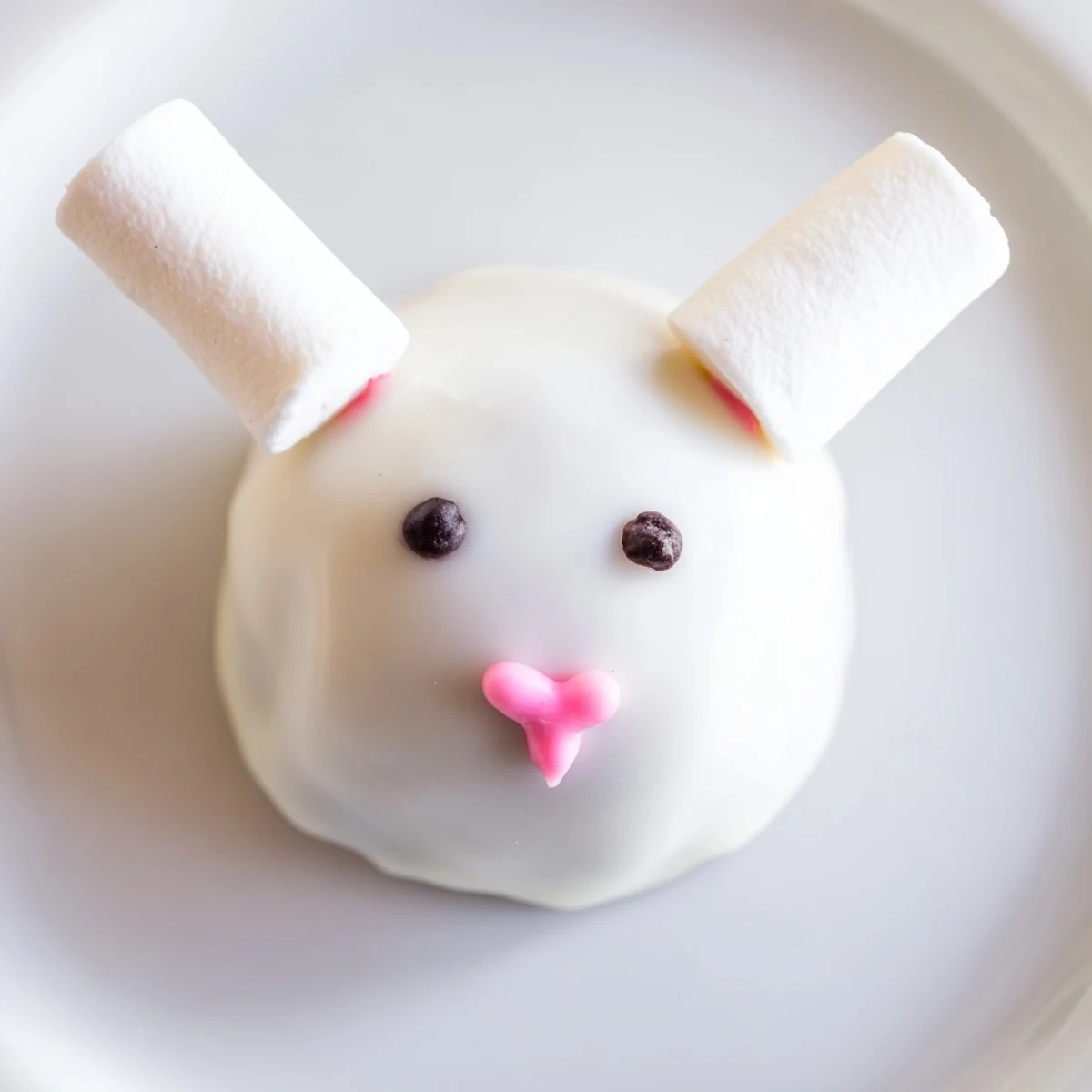 Handmade bunny Oreo balls featuring smooth white chocolate coating and pastel spring decorations perfect for celebrations