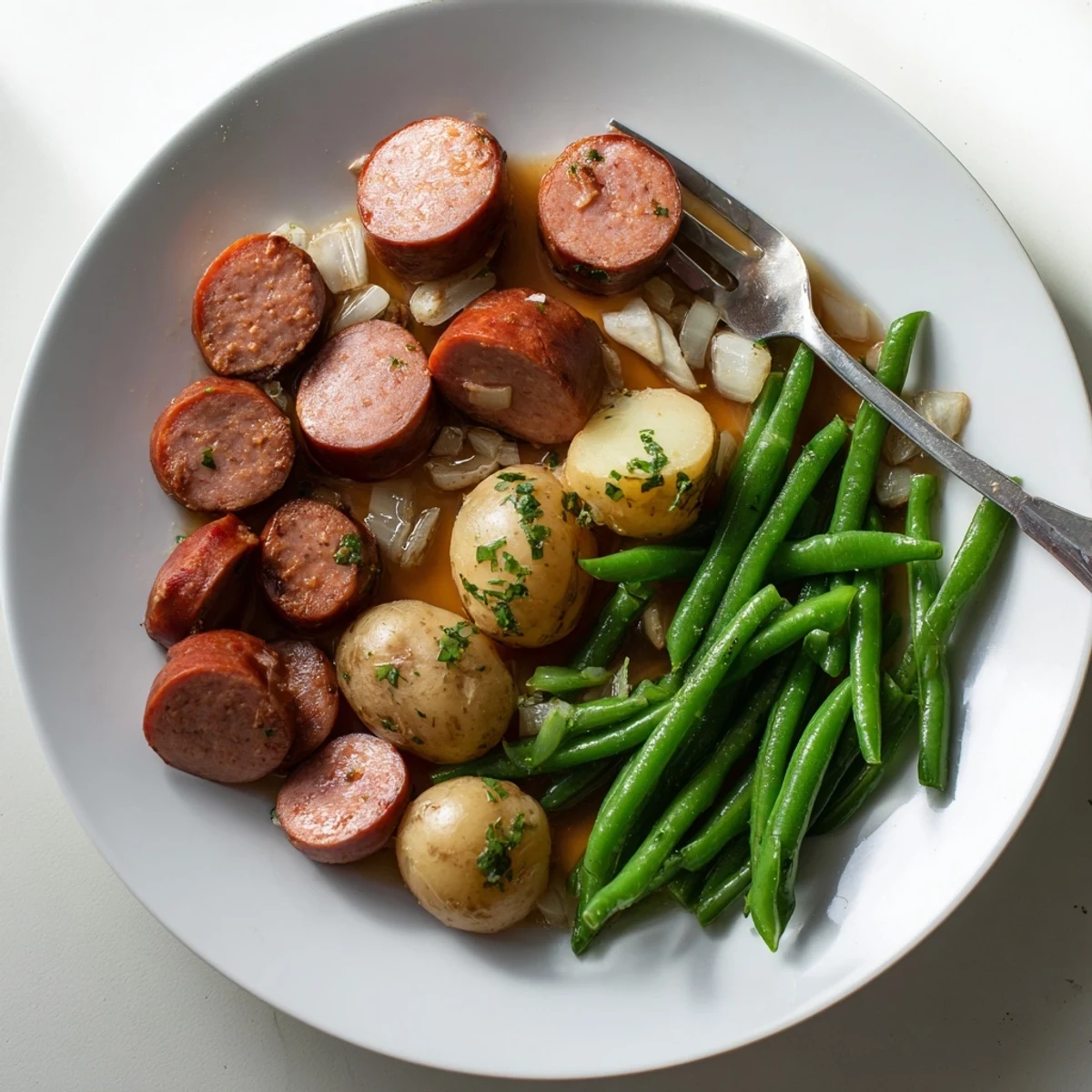 Hearty Crockpot Kielbasa and Green Beans dish with crisp vegetables and sliced sausage in a rich broth