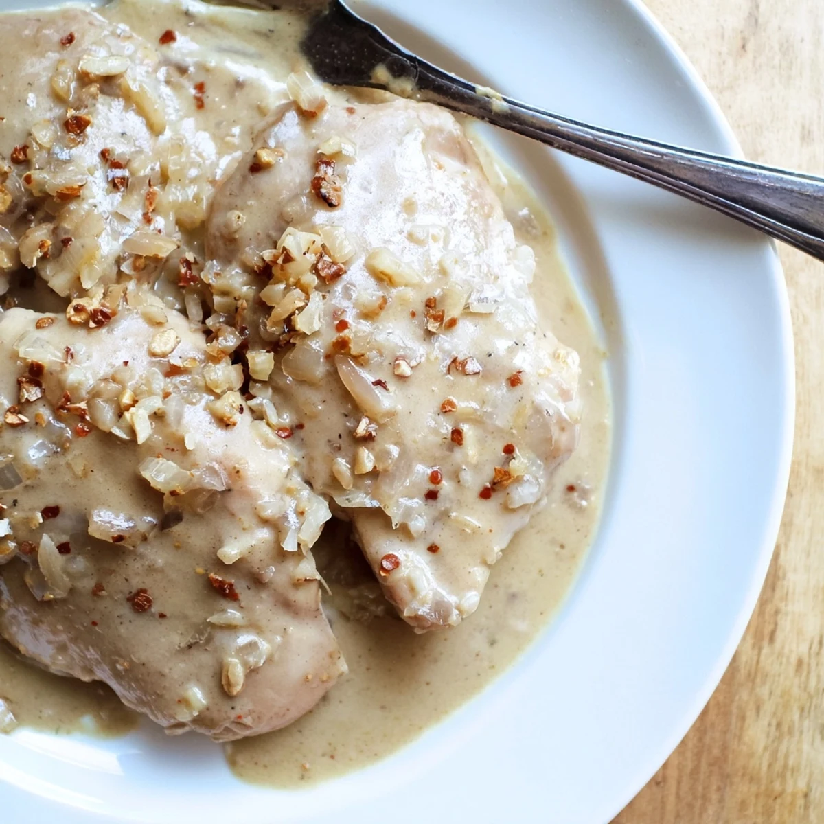 Juicy boneless chicken thighs in a thick savory gravy with Italian seasoning and paprika