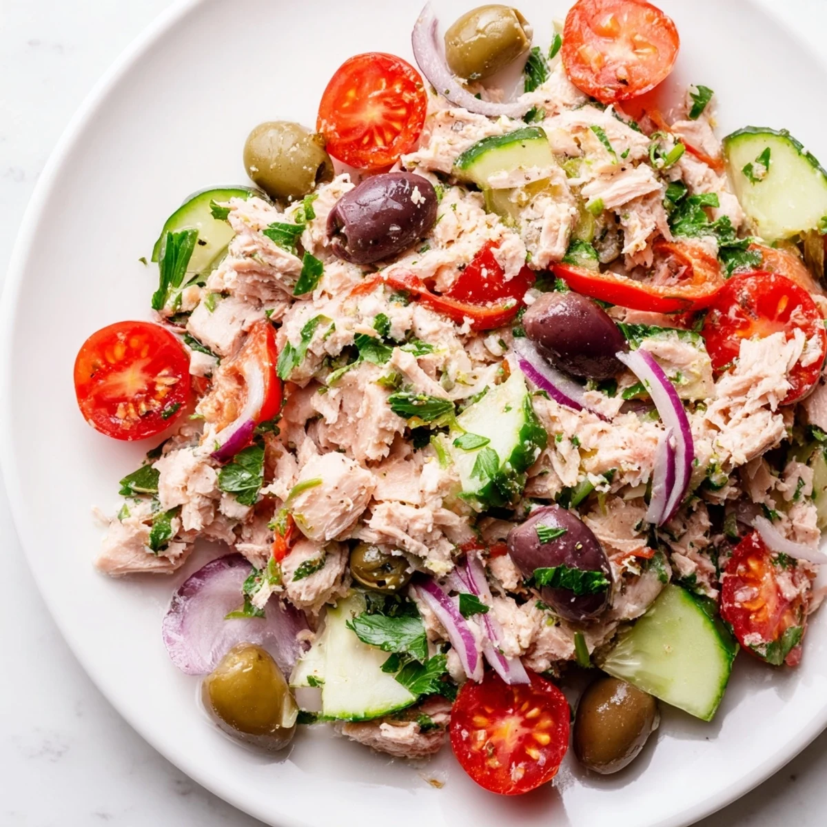 Flaked tuna mixed with crisp cucumber and bright herbs in Mediterranean Tuna Salad