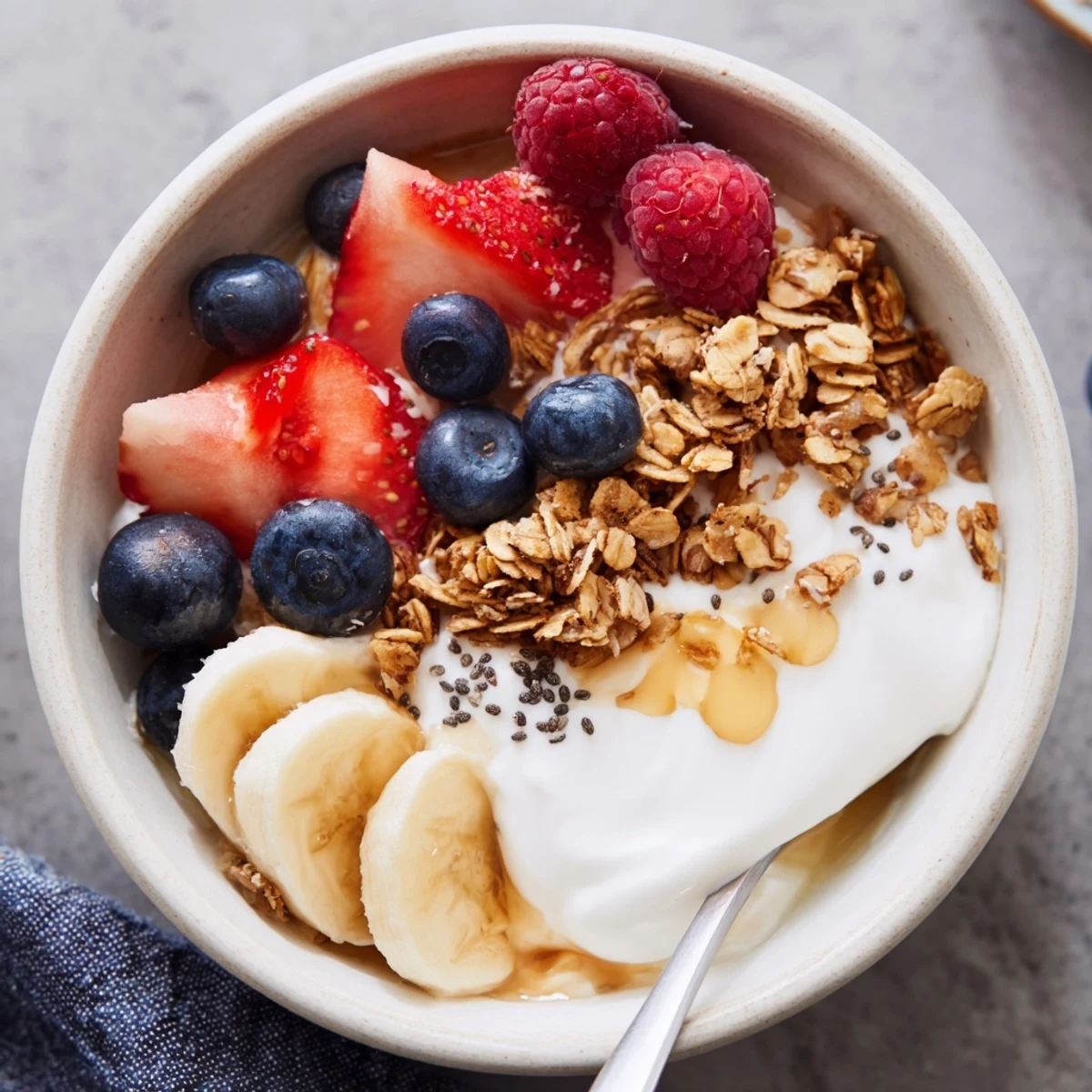 Bright Cottage Cheese Breakfast Bowl topped with sliced banana, chia seeds, and honey