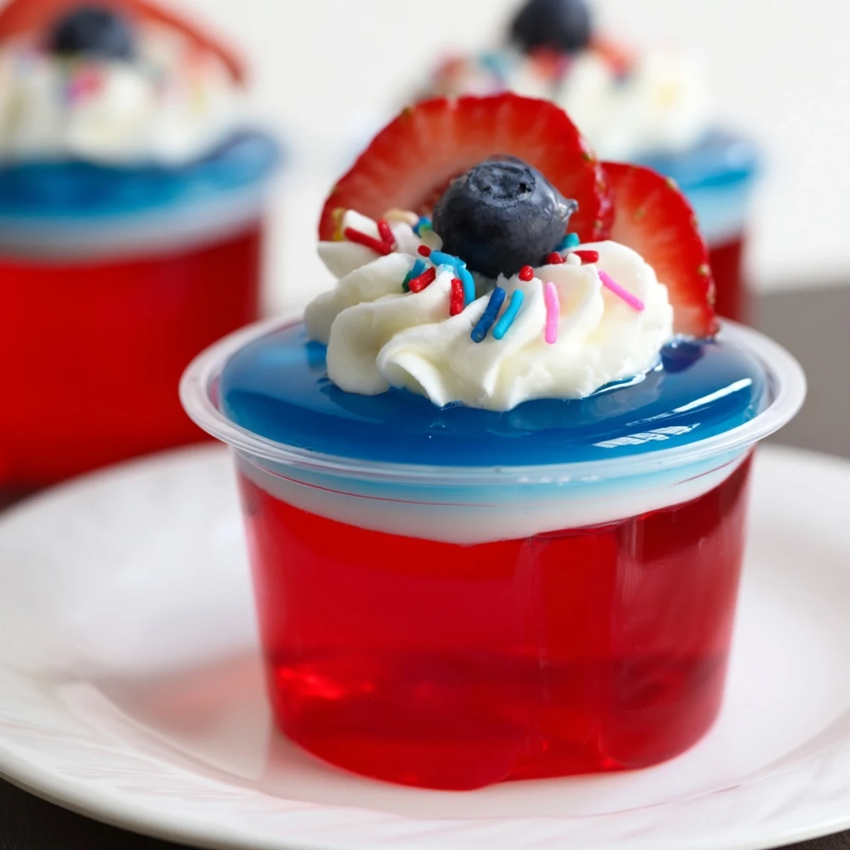 Red White And Blue Jello Cups vibrant gel layers wobble gently, served with spoon