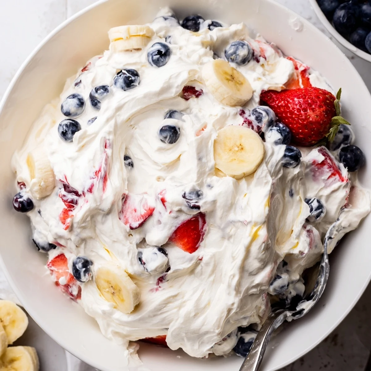 Red White And Blue Cheesecake Salad: creamy layers with juicy berries, chilled