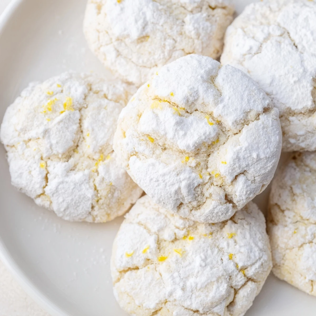Soft chewy lemon pixie cookies with fresh lemon zest and sugary white coating